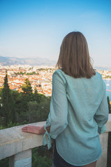 Fototapeta na wymiar Woman enjoying views of the old town of Split.