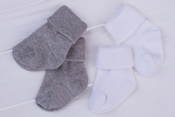 Two pairs of grey and white socks.