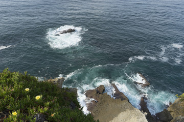 Cliff, aerial view of rocks hit by the waves of the sea, Cantabria, Spain