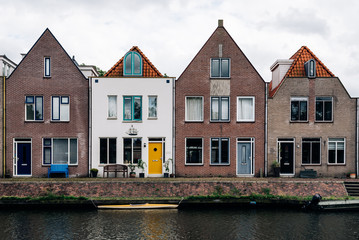 Fototapeta na wymiar Scenic view of canal and row houses in The Netherlands