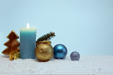 Blue Advent candle and decoration. Christmas background.