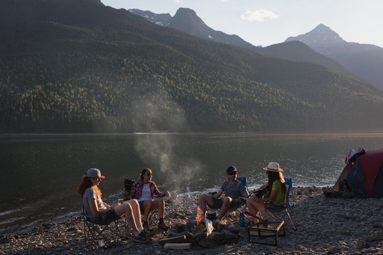 Group Of Friends Camping Near Riverside