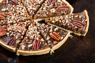 Pecan Pie, made from butter enriched pastry with golden syrup, maple sauce and breadcrumbs