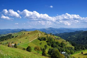 Fototapeta na wymiar Beautiful sunny day is in mountain landscape. Carpathian, Ukraine.