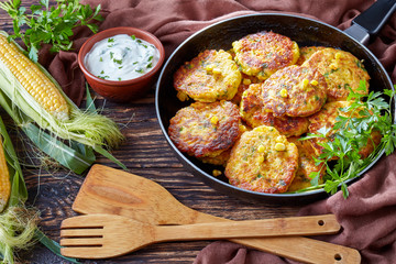 fried corn fritters in a skillet