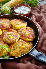 fried corn fritters in a skillet