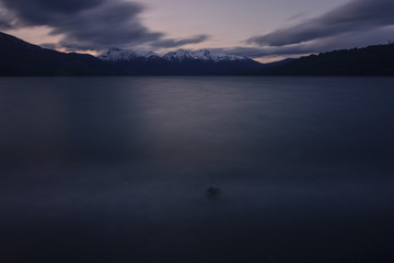 Scenic View Of Lake Against Snowcapped Andes Mountains