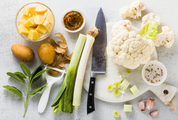 vegetables for soup on a table with spices and a chef's knife. culinary photo for recipes step by stepn a table with spices and a chef's knife. culinary photo for recipes step by step