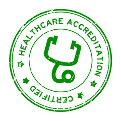 Grunge green healthcare accreditation with stethoscope icon round rubber seal stamp on white background