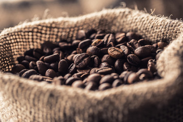Close-up fresh roasted coffee beans in bag
