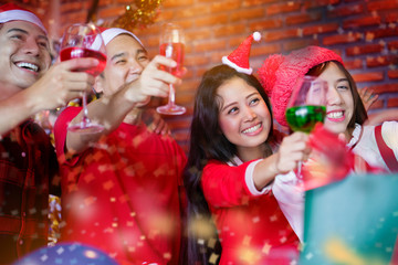 Portrait of a happy group couple asian at a Christmas party. And happy new year But fun, smile to love each other. The deal will make the family's friendship just fine.