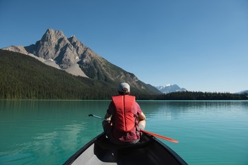 Man boating in river at countryside