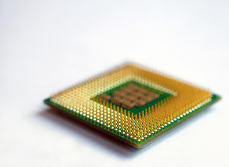 Isolated closeup microprocessor cpu lying on white table