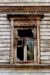 Fototapeta na wymiar broken window in an old wooden house