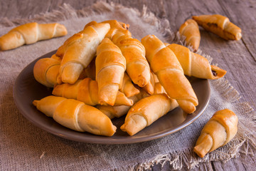 Homemade croissants with chocolate, delicious sweet rolls 