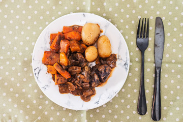 Beef meat stewed with potatoes-Traditional French cuisine Beef Bourguignon potatoes carrots in persillade