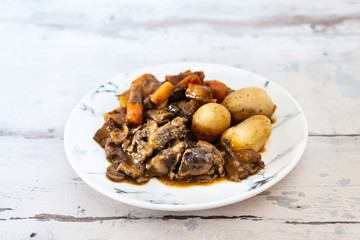 Beef meat stewed with potatoes-Traditional French cuisine Beef Bourguignon potatoes carrots in persillade