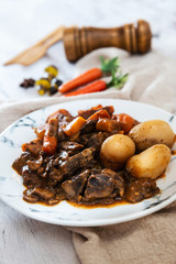 Beef meat stewed with potatoes-Traditional French cuisine Beef Bourguignon potatoes carrots in persillade