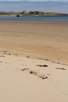 The Large Expansive Beach At Beadnell Bay