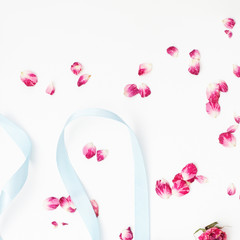 Petal flower on white background with blue ribbon.Flat lay.Valentines,love and wedding concept ideas