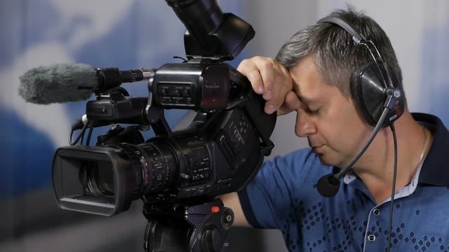 The television operator fell asleep behind the camera