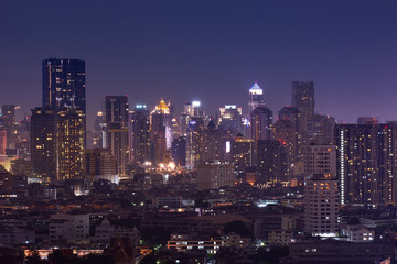 Fototapeta na wymiar night cityscape metropolis downtown lighting up on skyline