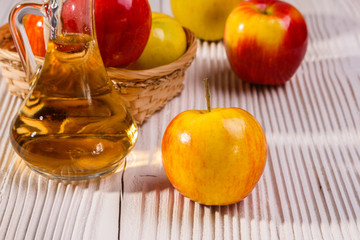 apple vinegar on a wooden rustic background