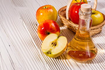 apple vinegar on a wooden rustic background