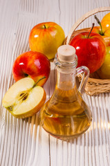 apple vinegar on a wooden rustic background