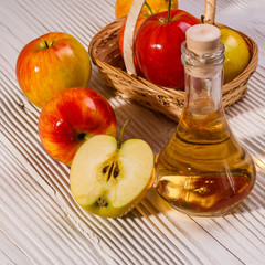 apple vinegar on a wooden rustic background