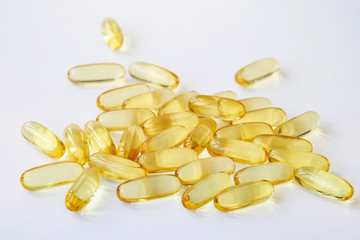 Selective focus of Fish oil capsules isolated on white background
