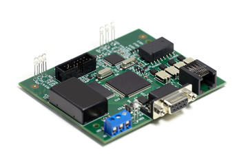 Electronic printed circuit board with chips and other components, green color, front side, angled...