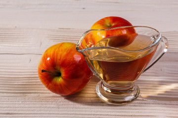 apple vinegar on a wooden rustic background
