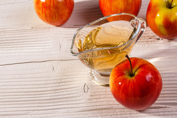 apple vinegar on a wooden rustic background