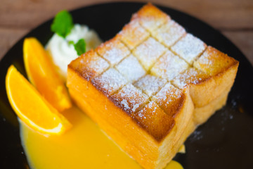 Honey toast with orange fruit slice