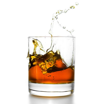 Whisky Glass With Splashes, Isolated On White