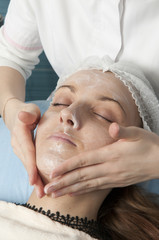 Fototapeta na wymiar Woman doing facial beauty treatments