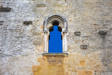 Fototapeta na wymiar Italy, Gioia del Colle, Norman-Swabian Castle, 9th century. View of the internal facades of the court. Detail of windows.