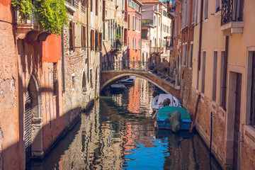 Fototapeta na wymiar boats in narrow canals in Venice, Italy