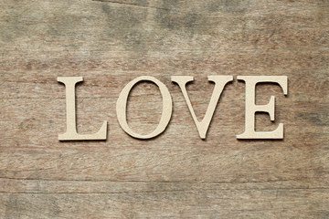 English alphabet in word love on wood background
