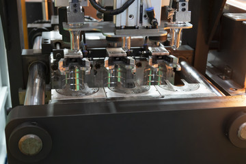 The  preform shape in the blowing mold  for plastic bottles manufacturing process at the drinking...