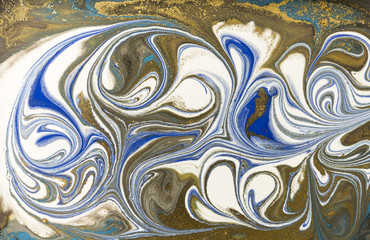 Gold marbling texture design. Blue and golden marble pattern. Fluid art.