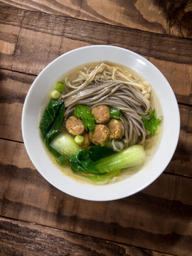 Chinese noodle soup with Chinese sausages and Japanese mushrooms
