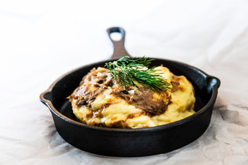 Dish made with cooked duck meat, dehydrated potato, fresh cream of mushroom and cheese