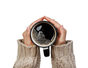 Woman holding cup of hot coffee isolated on white, closeup photo of hands in warm sweater with mug,...