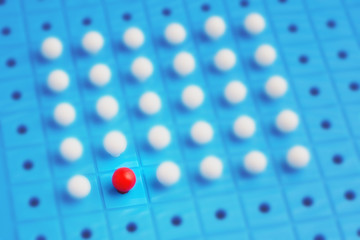 Unique red pin among many white ones. Stand out of crowd, individuality, difference and leadership...