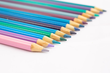 Cool Shades of colored pencils in a group against white background