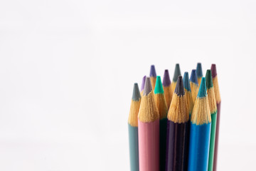 Cool Shades of colored pencils in a group against white background