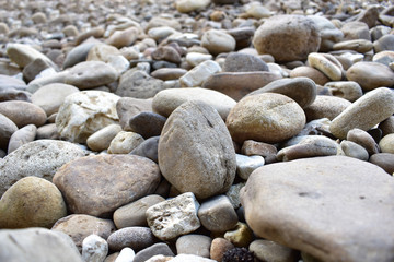 Fototapeta na wymiar many smooth river rocks