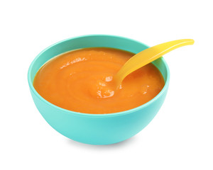 Bowl of healthy baby food on white background